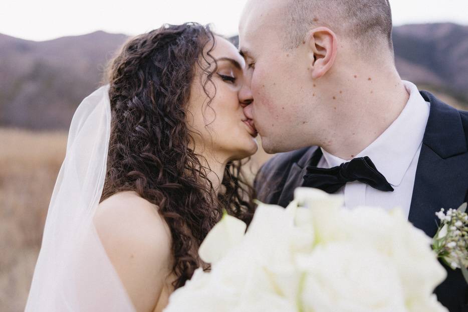 Bride and groom kissing