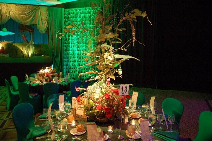 Customized table settings, centerpiece and floral design by MBM