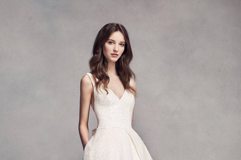 White by Vera Wang Style VW360301 <br> The knotted halter neckline is the highlight of this short chiffon bridesmaid dress, finished with a shiny satin sash.  Short, knee-length dress with halter gathered skirt. A trendy satin sash that snaps to dress while cinching the waist.