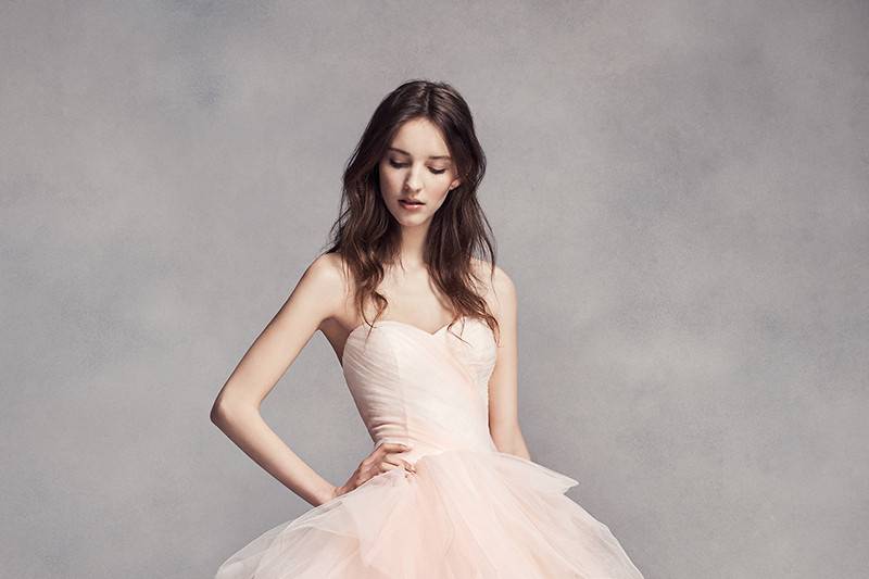 Style VW351303 <br> Tulle ball gown with halter V-neckline, satin bodice, and horizontally smocked skirt.