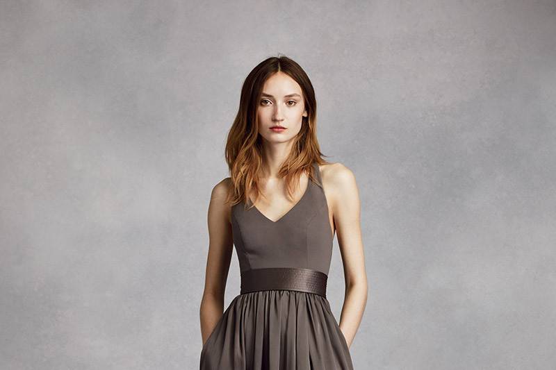 perfect for your wedding party or any special occasion!  Sleeveless V-neck wrapped bodice is adorned with an elegant satin belt. Long, soft chiffon skirt features cascading bias cut ruffles.
