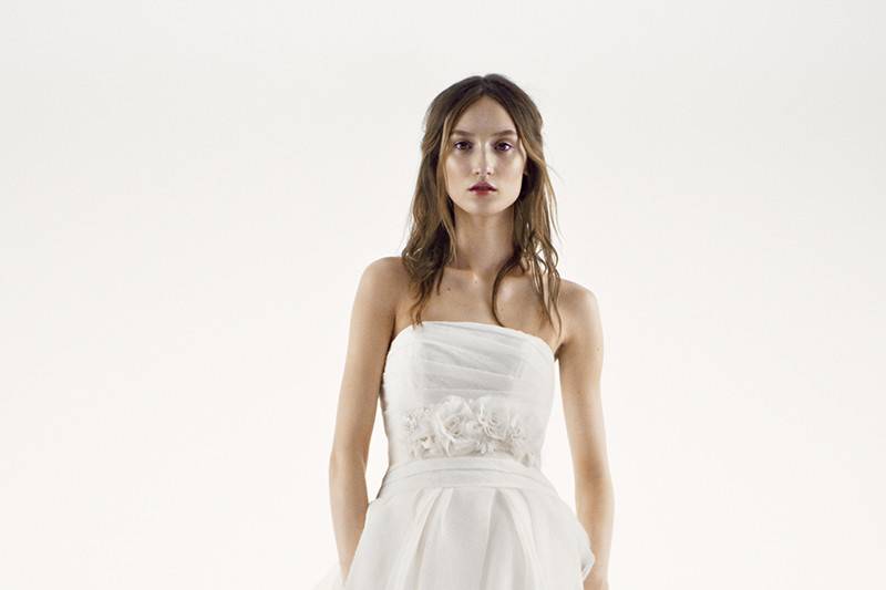 White by Vera Wang Style VW351172	<br>	Net fit-and-flare gown with halter neckline and draped bodice. Gown features skirt with sequined organza and tulle ruffles.