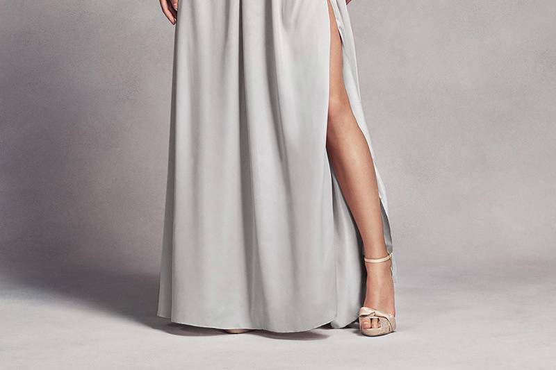 White by Vera Wang Style VW360275	<br>	Chiffon ruffles follow the midline of this long, glamorous bridesmaid dress with a sheer peekaboo hem in front.