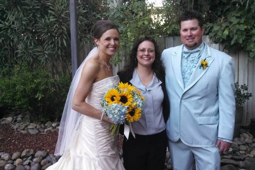 Bride and groom with their officiant