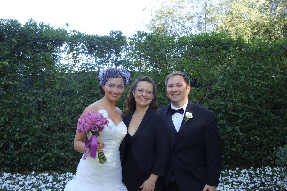 Wedding officiant with the newlyweds