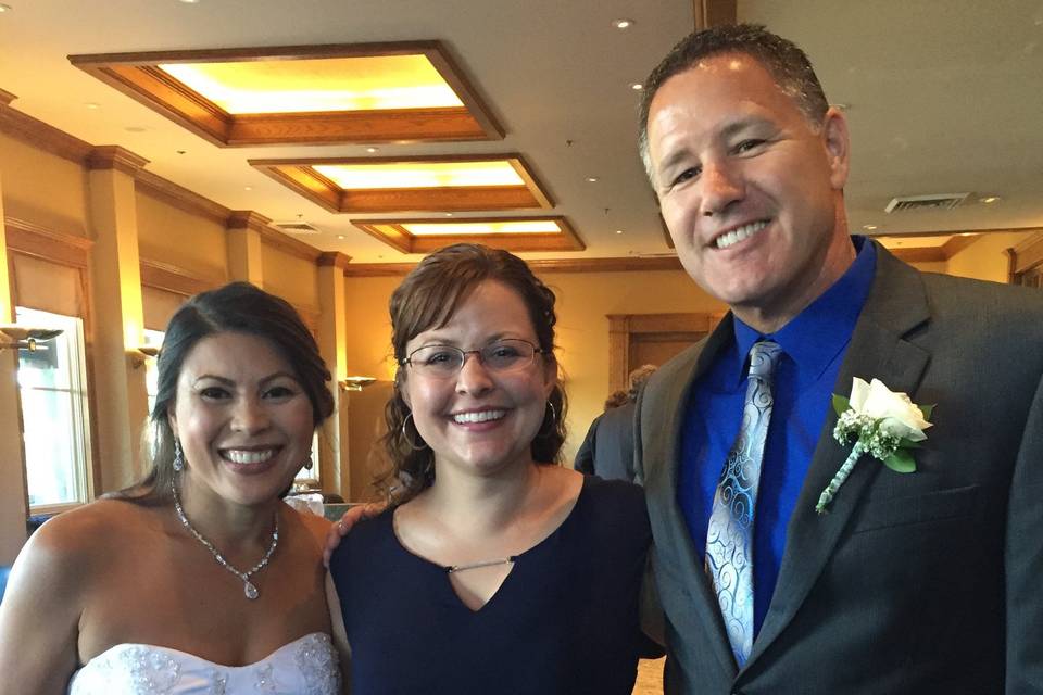 Newlyweds and their wedding officiant