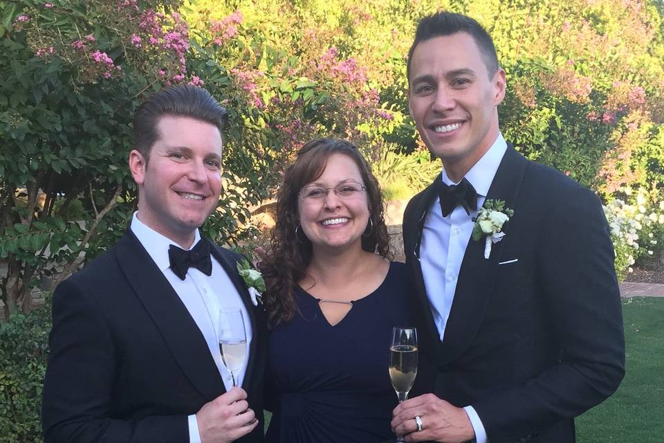 Wedding officiant with the grooms