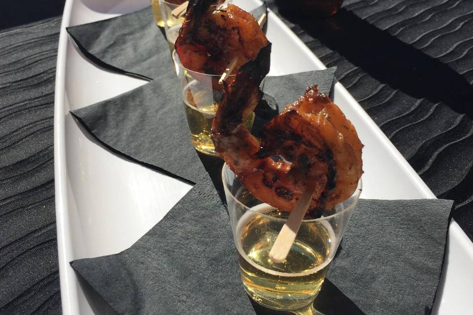 Fun! Jamaican Jerk Shrimp, chargrilled and served on a shot of ice cold Red Stripe Beer! Would your guests enjoy this spicy/sweet hors d' oeuvre at your wedding!