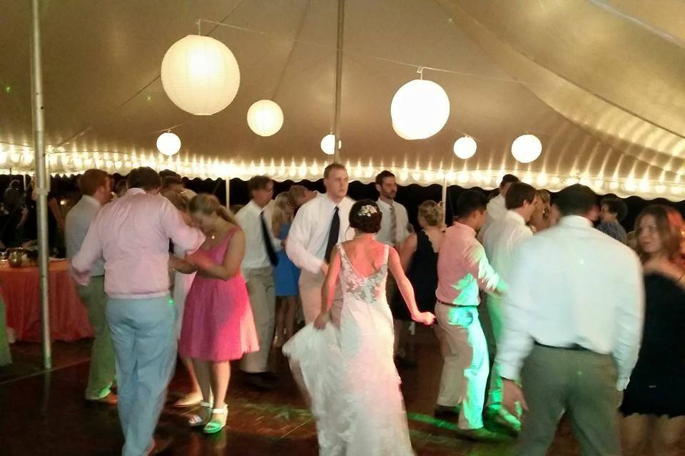 Couple and guests dancing