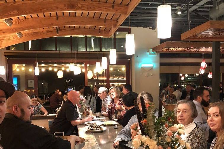 Food and Dessert stations set up at the bar for a charity event.