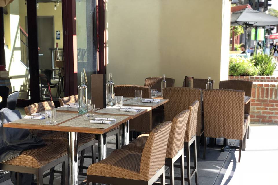 Al Fresco dining on a warm Saturday afternoon on the Rose Avenue patio - sliding glass doors opening into the restaurant and a privacy screen
