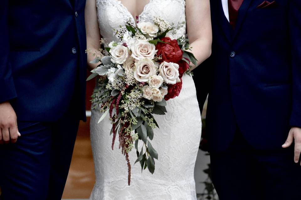 An elegant , contemporary bouquet, perfectly compliments such an elegant gown.