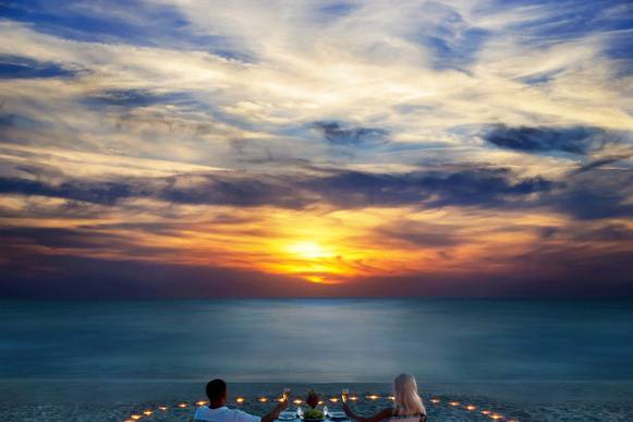 Beach side candle-lit dinner