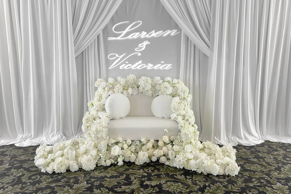 White rose garland on couch