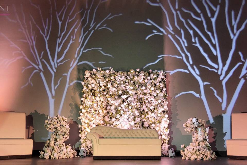 Straight couches, flower wall