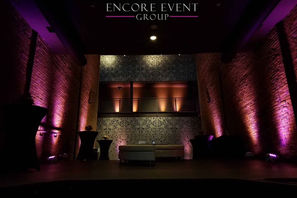 Pink uplighting on brick