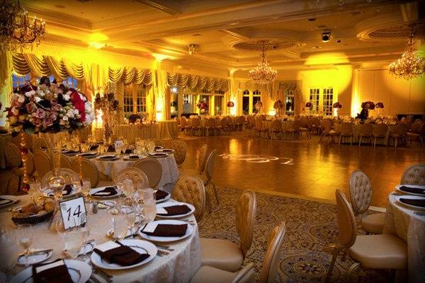 Ambiance.  Up-lighting is one of the most inexpensive ways to add customization and a touch of something extra to your ballroom.Photo by The Studio Photographers