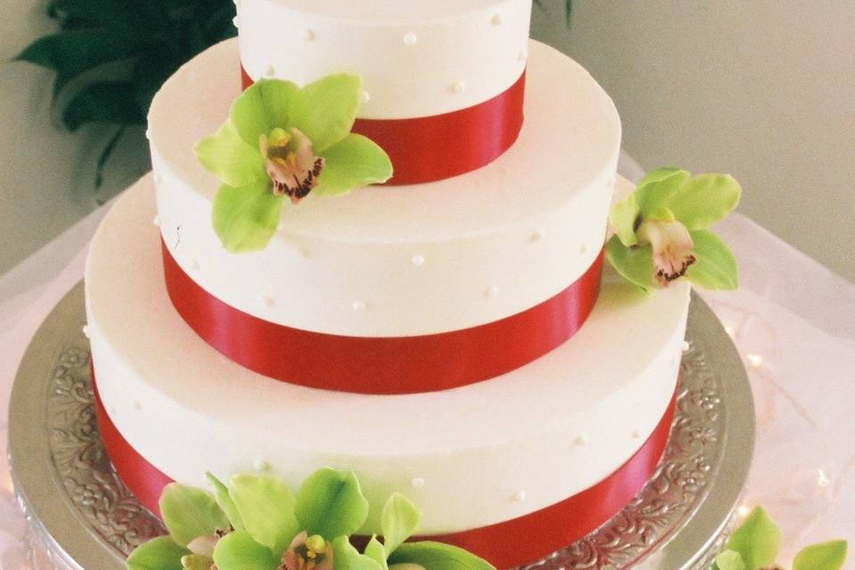 Three tier cake with red lining