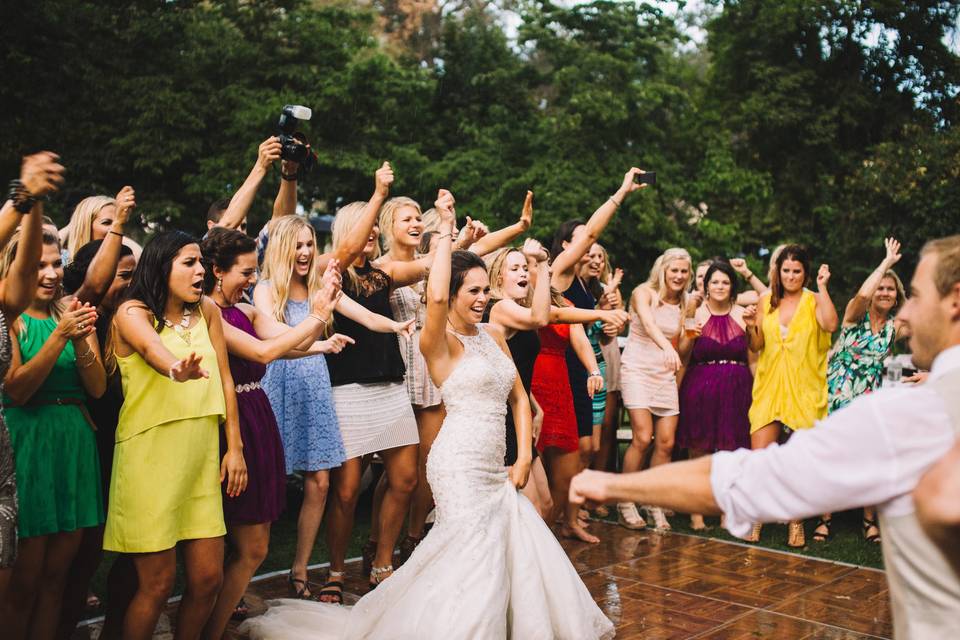 The bride and guests dancing