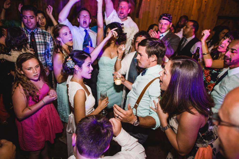 The couple and guests dancing