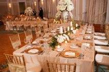 Kate Ryan Linens Champagne Taffeta Tablecloths with Champagne Crushed Taffeta Table Runners, Ivory Classic Napkins & Champagne Crystal Organza Sashes. Photography by:Aaron Lockwood