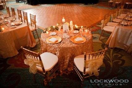 Kate Ryan Linens Golden Champagne Button Taffeta Tablecloths, Ivory Classic Napkins & Champagne Crystal Organza Sashes. Photography by:Aaron Lockwood