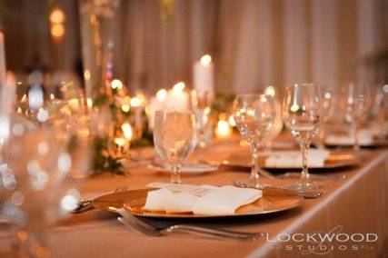 Kate Ryan Linens Champagne Taffeta Tablecloths with Champagne Crushed Taffeta Table Runners, Ivory Classic Napkins & Champagne Crystal Organza Sashes. Photography by:Aaron Lockwood