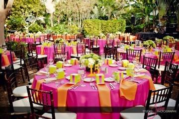 Kate Ryan Linens Fuchsia Classic Tablecloths with Classic Orange Napkins..Chiavari's: Eventfully Yours Rentals, Event Design: Swankey Events, Photography: Studio Julie, Venue: Hemingway House in Key West, Florida