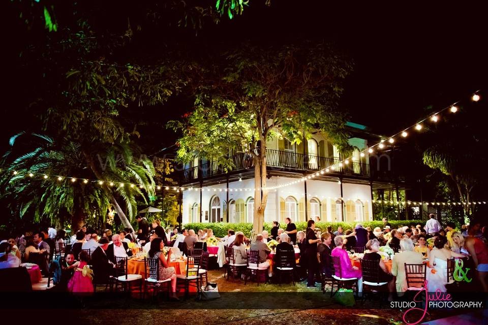 Kate Ryan Linens Fuchsia Classic & Orange Satin Tablecloths with Classic Orange Napkins..Chiavari's: Eventfully Yours Rentals, Event Design: Swankey Events, Photography: Studio Julie, Venue: Hemingway House in Key West, Florida