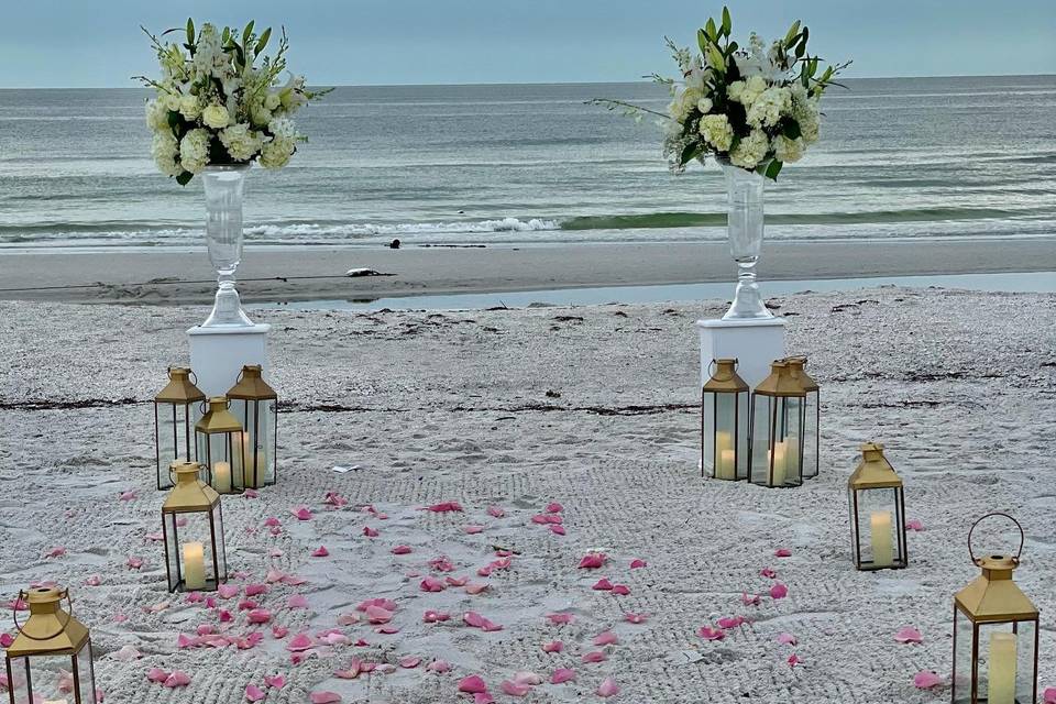 Aisle with flowers and lanterns