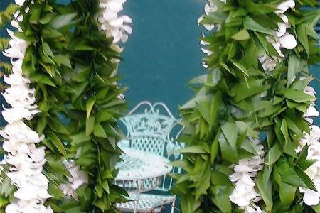 Traditional ti--leaf lei are worn by the groom or groomsmen.