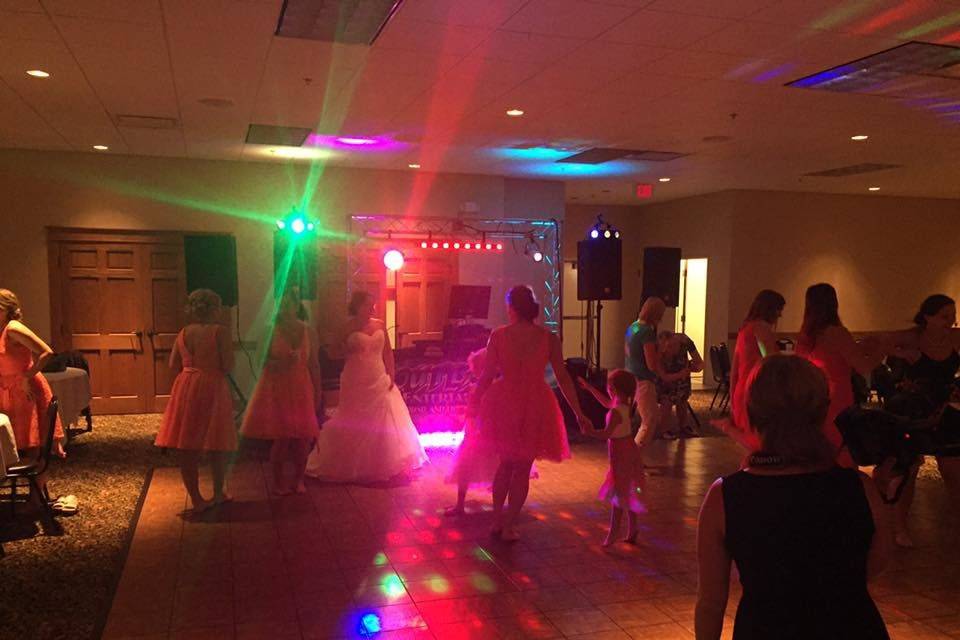 The bride and guests dancing