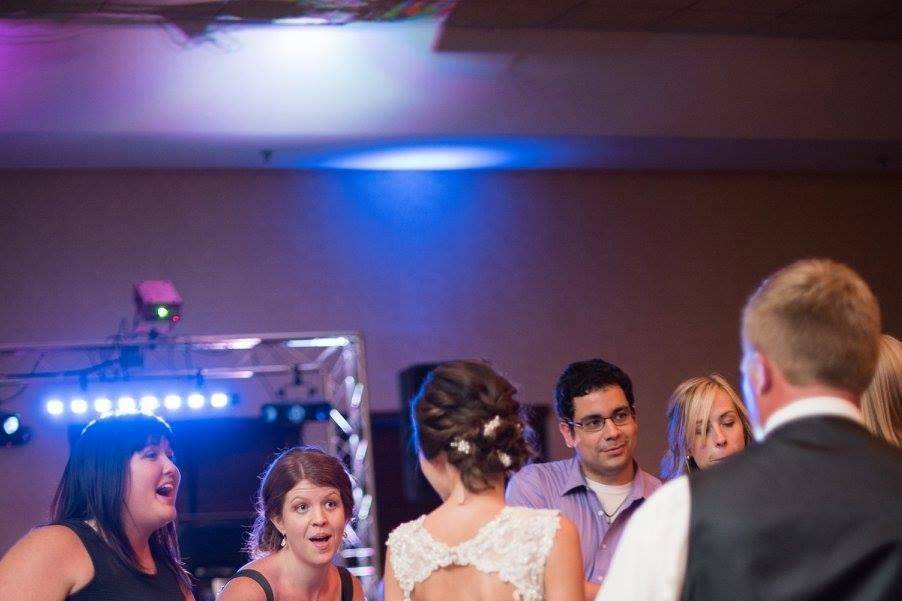 The couple and guests dancing