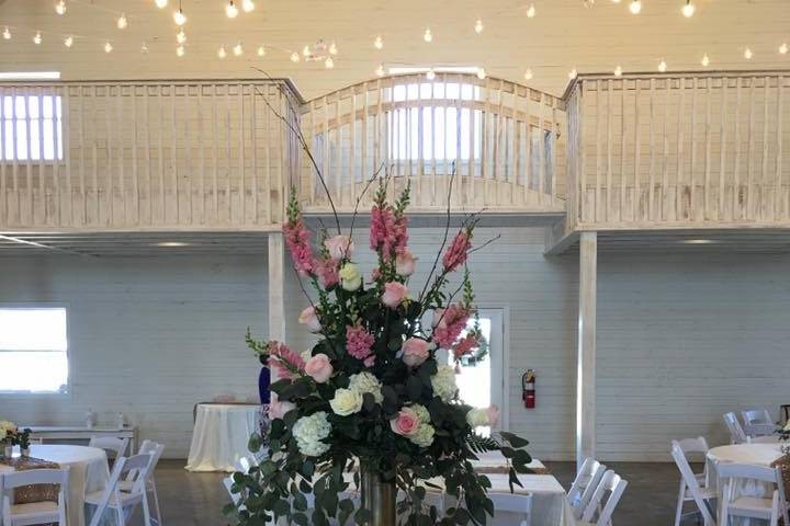 White tables with centerpiece