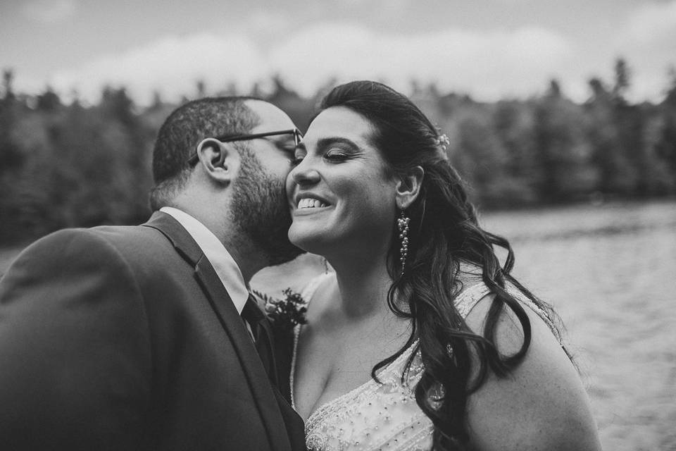 Groom kissing his bride