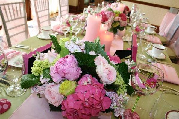 Table setting with floral and candle centerpiece