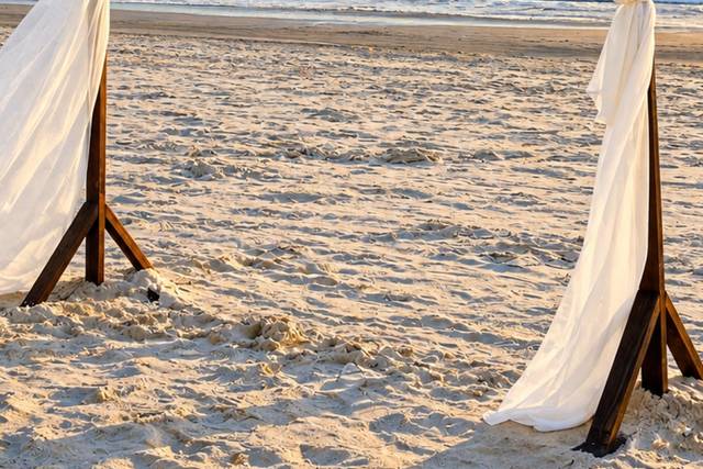 Romantic Beach Wedding Arch at Sunset.png
