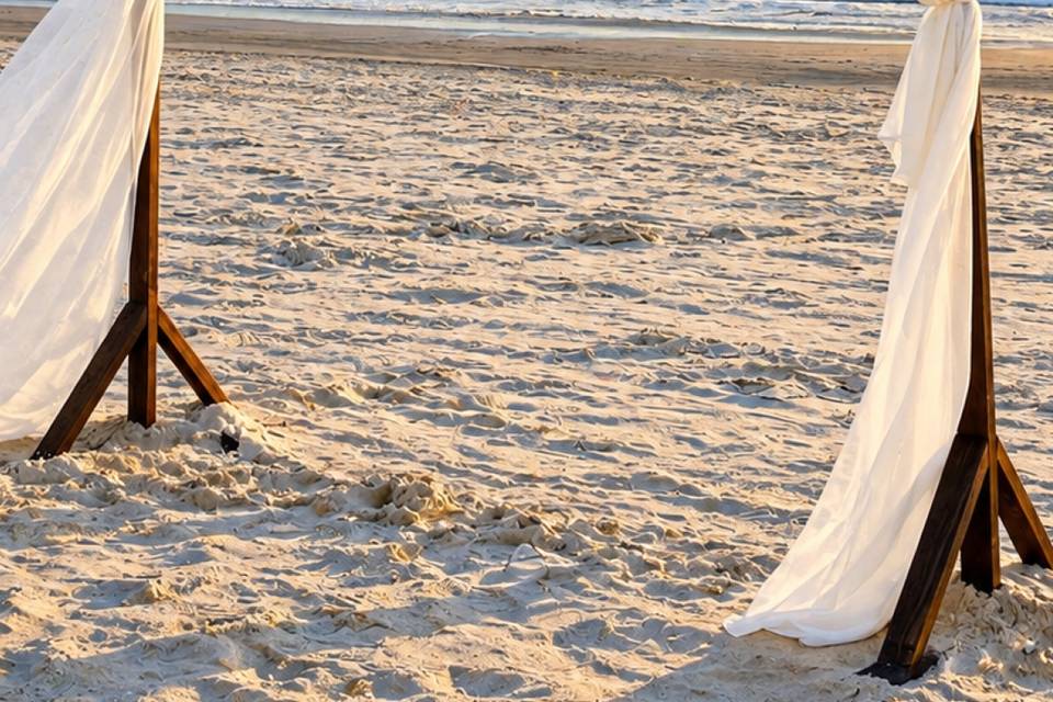 Romantic Beach Wedding Arch at Sunset.png