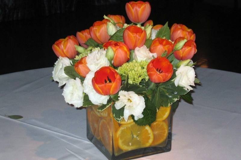 Flower centerpiece with orange blooms