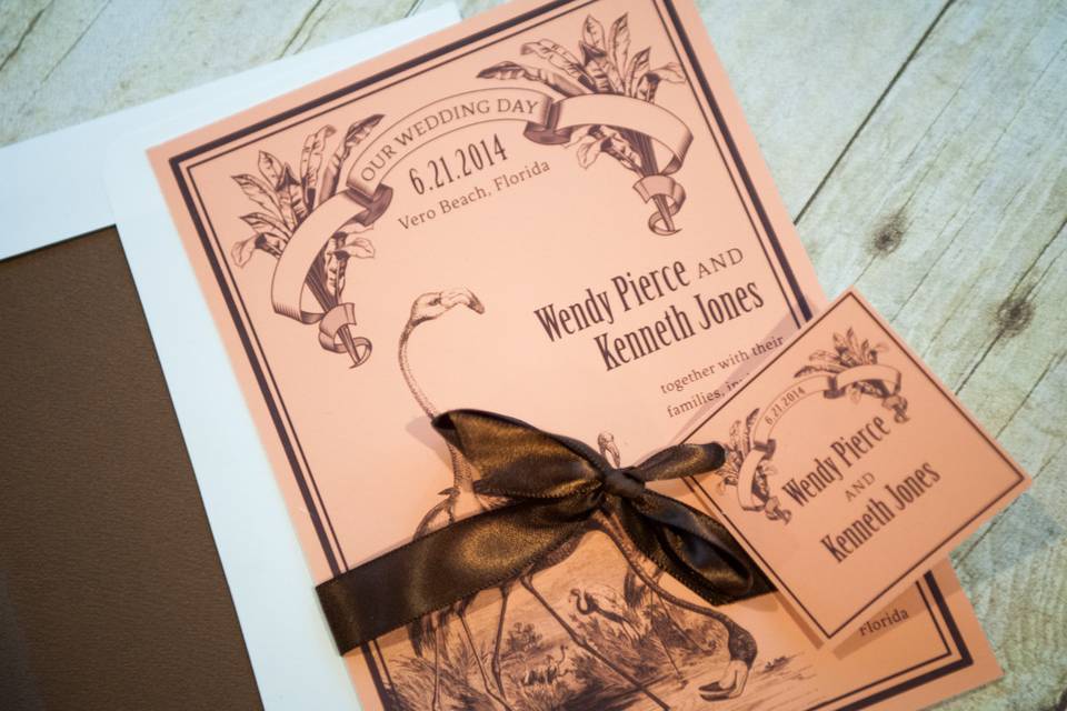 This beautiful and truly original invitation is a vintage style design reminiscent of an antique Floridian postcard and features wild flamingo's grazing in a field. The peachy pink and brown tones definitely suggest a summer event, but could also work well as a Floridian destination wedding at any time of year!