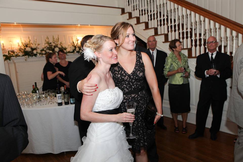 Bride taking photo with guests
