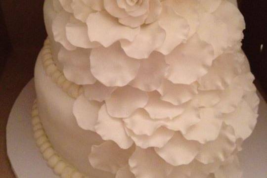3 tier wedding cake. 74 servings.  handmade gumpaste rose and flower petals.