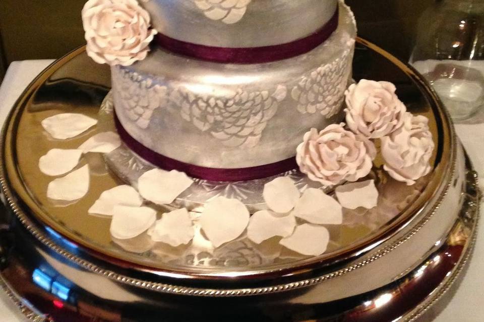 Silver and purple wedding cake with handmade gumpaste flowers.  74 servings. Flavors