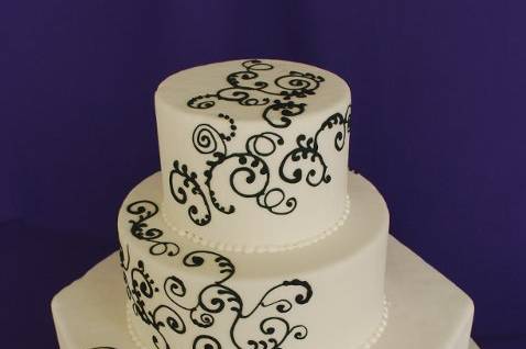 Modern black and white swirl pattern on white fondant cake