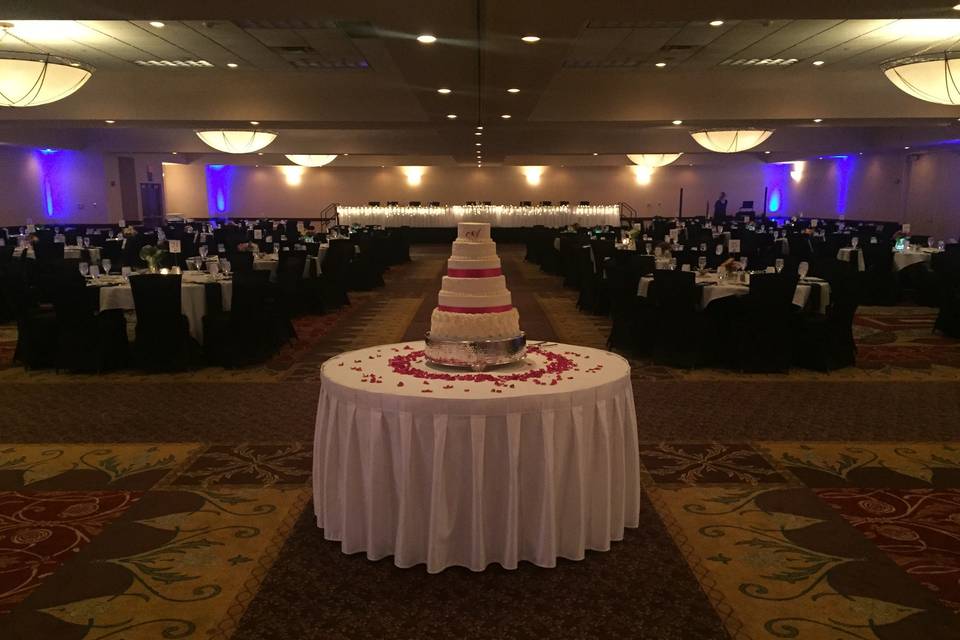 The wedding cake on full display in the ballroom