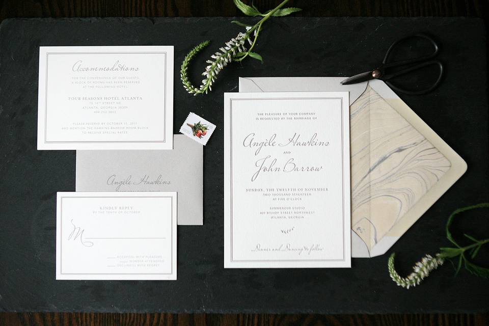 Simple and classic letterpress invitation suite with hand-marbled paper envelope liner.