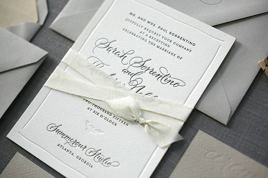 Classic letterpress wedding invitation suite in neutrals and metallics.