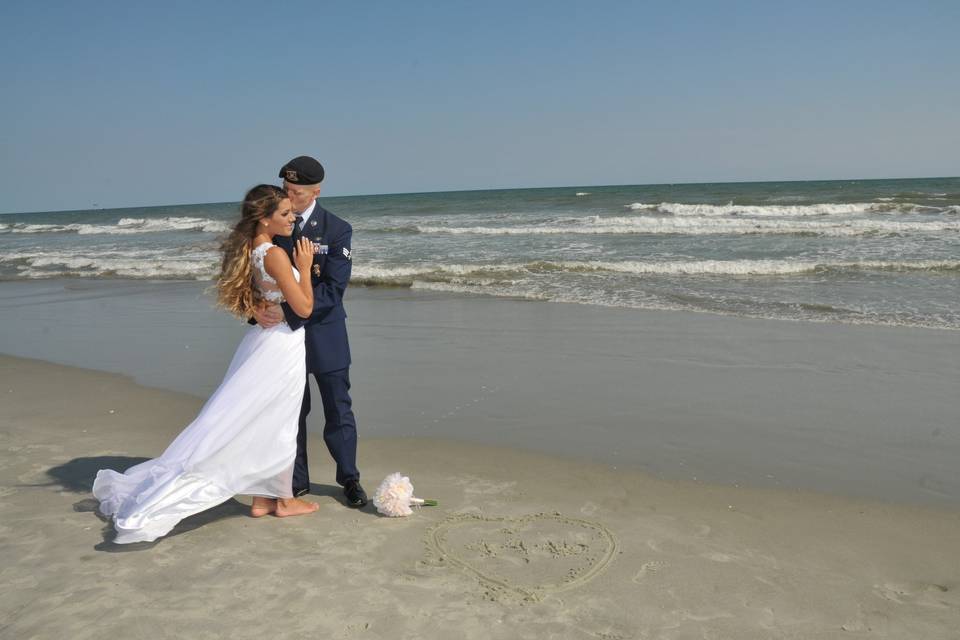 Groom holding his bride