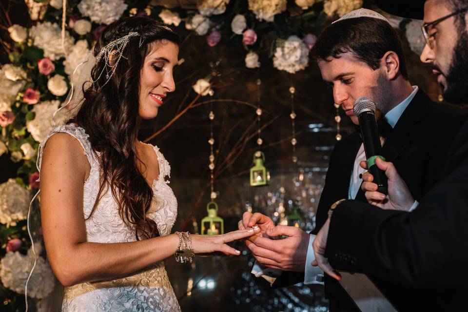 Putting the bride's ring on