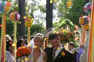 our festive ribbon poles and bright flowers for Leah & Jason